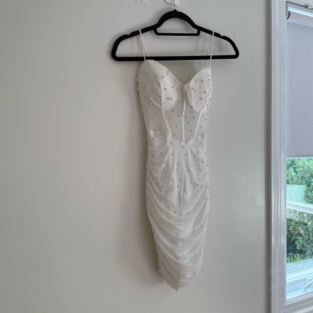 White mini dress with pearls